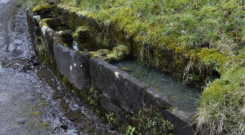 A water flowing through a ditch
Description automatically generated with medium confidence
